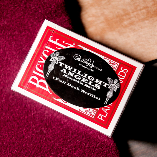 A pack of Twilight Angel playing cards by Paul Harris, with a red mandolin design on the packaging.