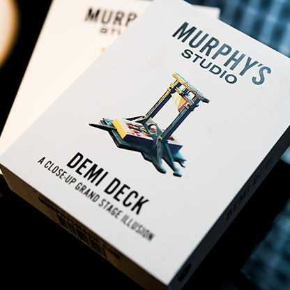 Packaging for 'Demi Deck' by Angelo Carbone, featuring an illustration of a deck with a cut in half, alongside the Murphy's Magic Studio logo.