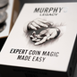 A boxed product labeled 'Murphy's Magic Legacy Expert Coin Magic Made Easy' with replica coins displayed in the background.