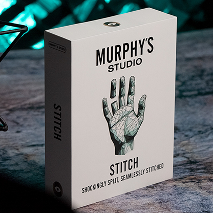 The image shows a product box for 'Stitch by Titanas', a close-up magic trick. The box is predominantly white and gray, with the title 'Stitch' and the creator's name 'Titanas' on it.